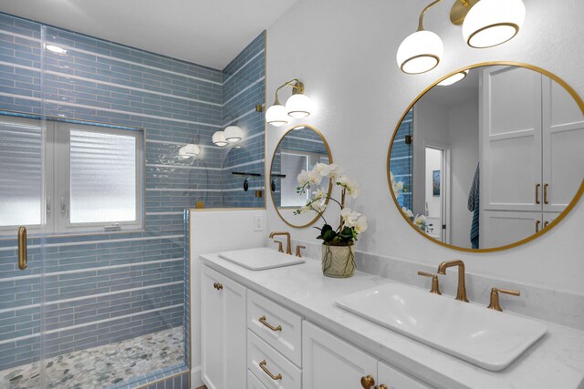 bathroom featuring vanity and an enclosed shower