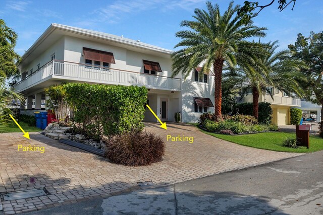 view of front of home with a balcony