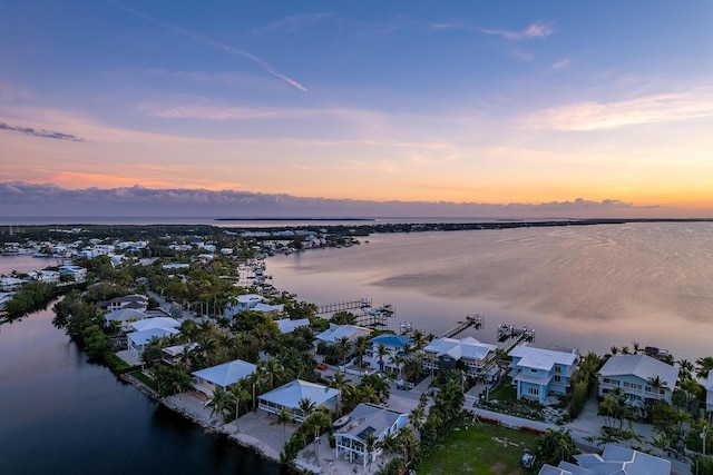 aerial view at dusk with a water view