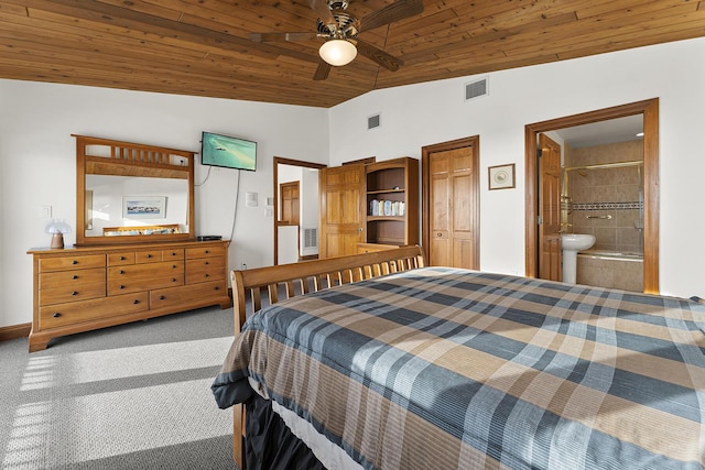 carpeted bedroom featuring connected bathroom, lofted ceiling, ceiling fan, and wooden ceiling