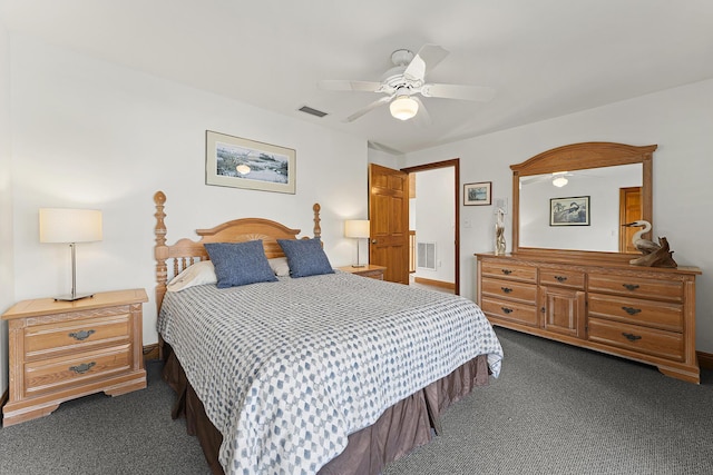 bedroom with ceiling fan and dark colored carpet