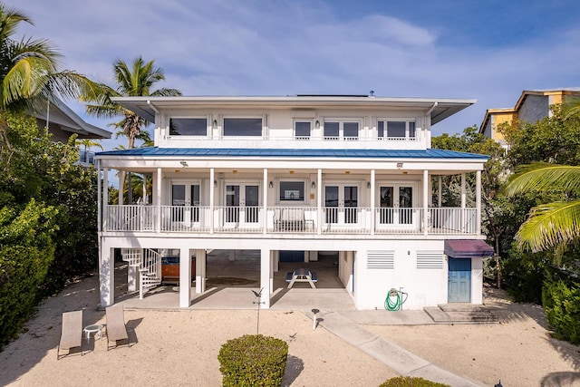 view of front of property with a patio and french doors