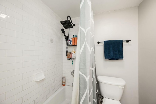 bathroom featuring shower / bath combination with curtain and toilet