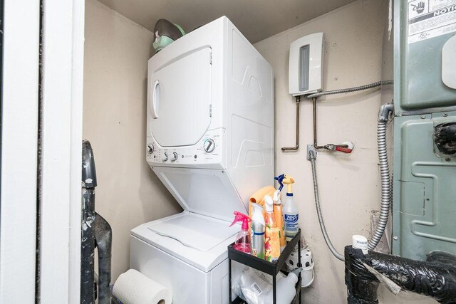 laundry area featuring stacked washer and clothes dryer