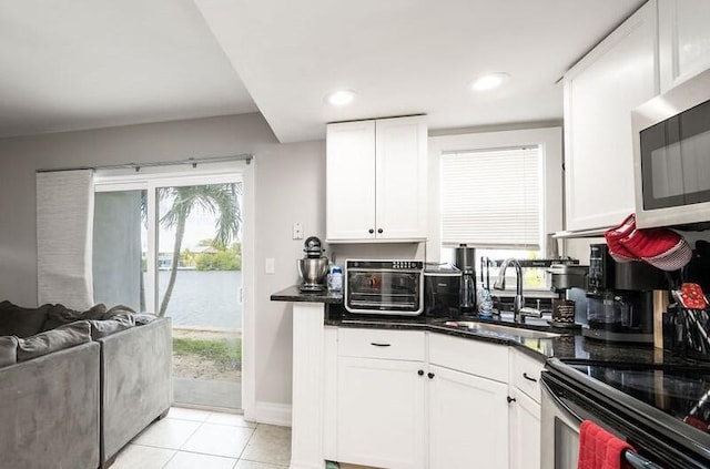 201 Coppitt Rd Unit 103A, Big Coppitt, FL 33040 - kitchen featuring white cabinetry, sink, and light tile patterned floors