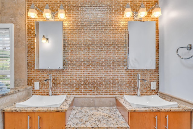 bathroom featuring vanity and a wealth of natural light