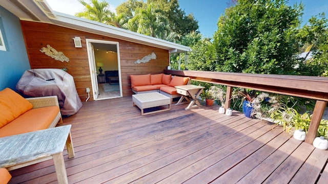 wooden deck with outdoor lounge area