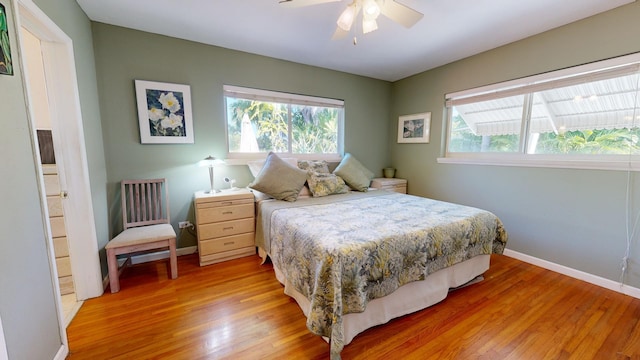 bedroom featuring hardwood / wood-style flooring and ceiling fan