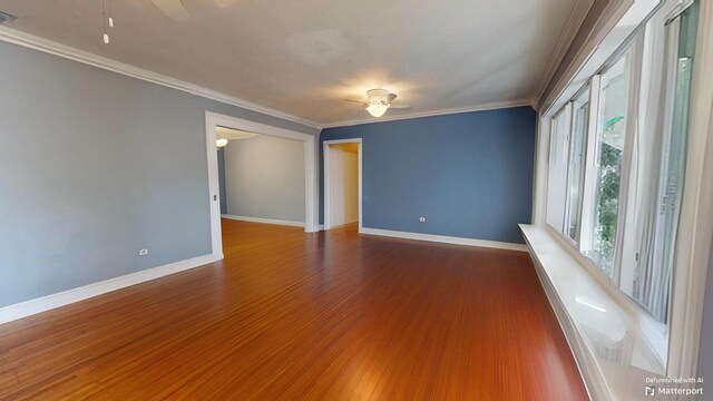 spare room with crown molding, wood-type flooring, and ceiling fan