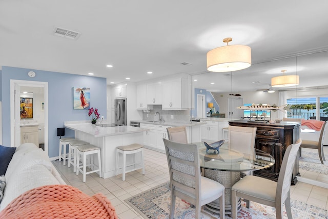 12690 Overseas Hwy Unit 411, Marathon, FL 33050 - dining area with light tile patterned floors, recessed lighting, and baseboards