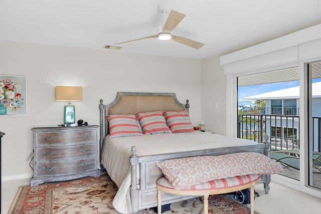 12690 Overseas Hwy Unit 411, Marathon, FL 33050 - bedroom featuring access to outside, a ceiling fan, and baseboards