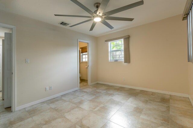 spare room with ceiling fan