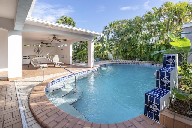 view of pool with a patio and ceiling fan