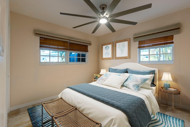 tiled bedroom with ceiling fan