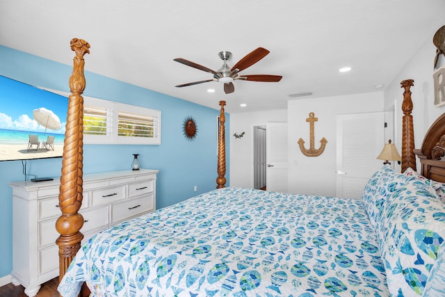 bedroom featuring wood-type flooring and ceiling fan