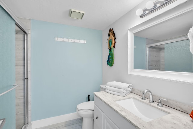 bathroom featuring vanity, hardwood / wood-style flooring, toilet, and walk in shower