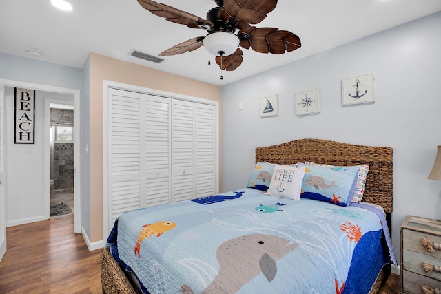 bedroom featuring ceiling fan, hardwood / wood-style floors, and a closet