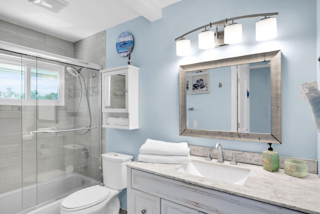 full bathroom featuring vanity, toilet, and combined bath / shower with glass door