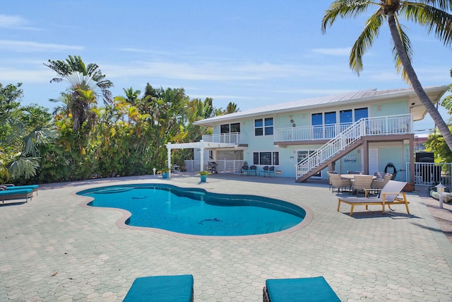 view of swimming pool with a pergola and a patio area