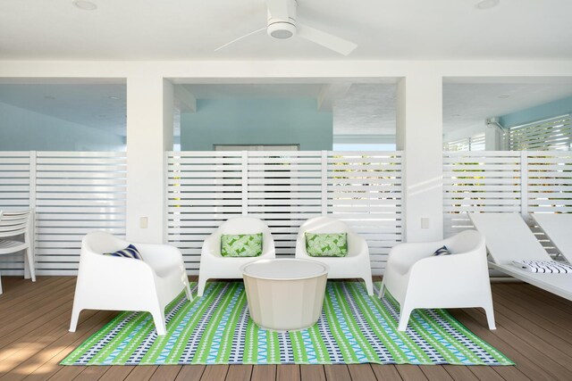 sitting room featuring hardwood / wood-style floors and ceiling fan