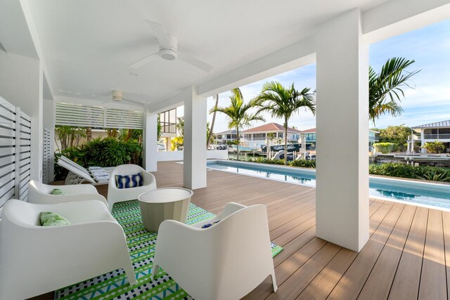 wooden terrace featuring ceiling fan