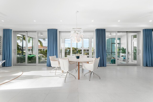 unfurnished dining area with plenty of natural light and a chandelier