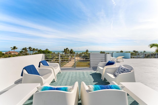 view of patio with outdoor lounge area, a balcony, and a water view