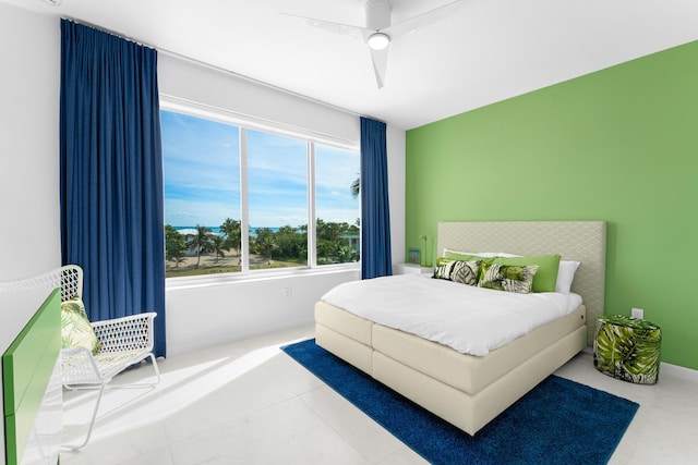 tiled bedroom with ceiling fan