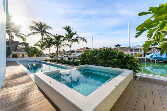 view of pool featuring an in ground hot tub