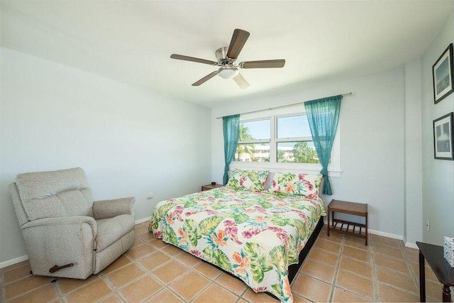 tiled bedroom with ceiling fan