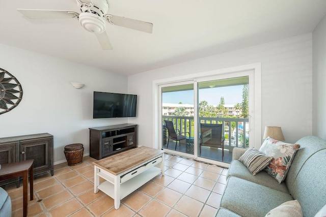 living room featuring light tile patterned floors and ceiling fan