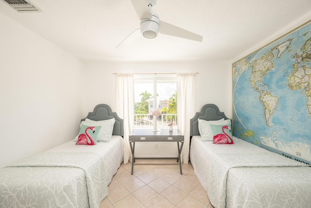 bedroom with light tile patterned floors and ceiling fan