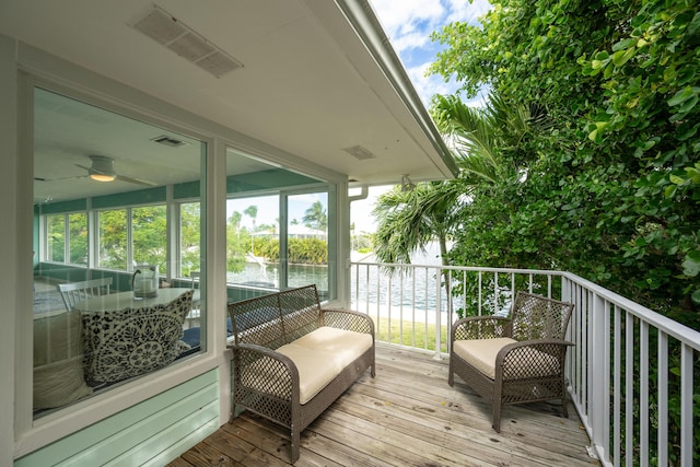 wooden deck featuring a water view