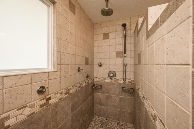 bathroom featuring tiled shower