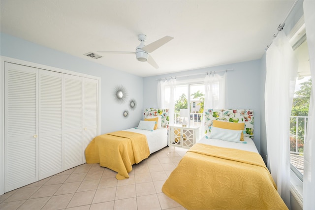 tiled bedroom featuring a closet and ceiling fan