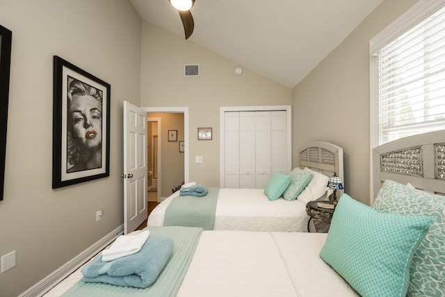 bedroom with ceiling fan, vaulted ceiling, and a closet