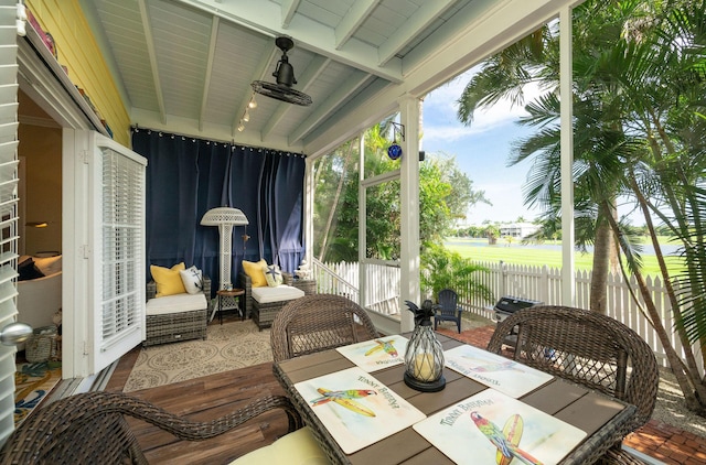 sunroom / solarium with beamed ceiling