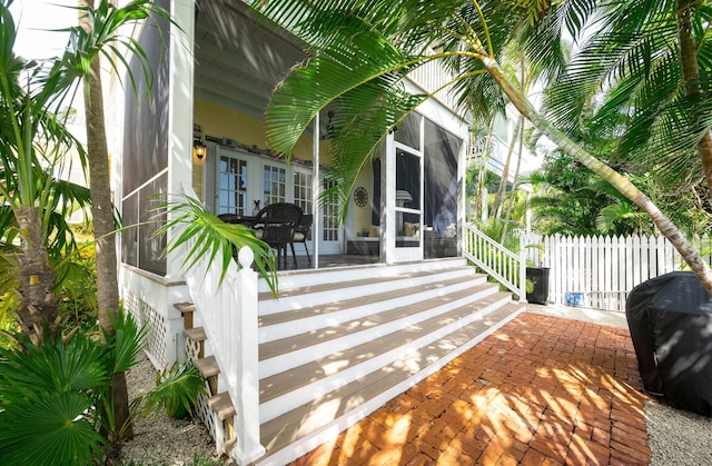 entrance to property with french doors and a patio area