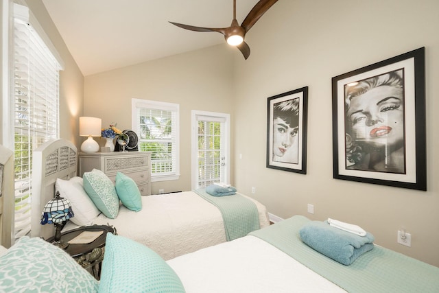 bedroom with ceiling fan, vaulted ceiling, and access to outside