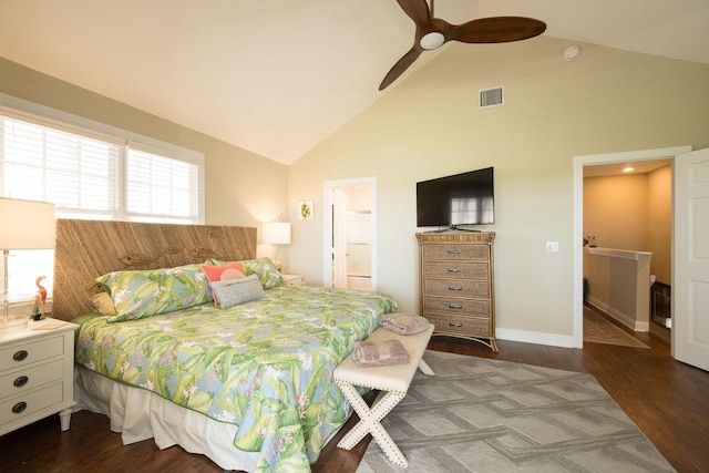 bedroom with ceiling fan, ensuite bathroom, dark hardwood / wood-style floors, and high vaulted ceiling