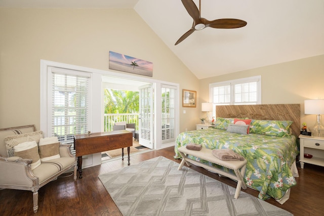 bedroom featuring ceiling fan, dark hardwood / wood-style floors, access to exterior, and high vaulted ceiling