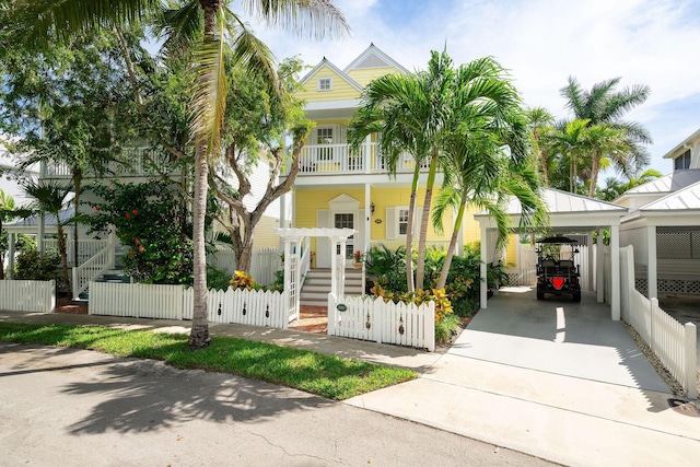 view of front of property featuring a carport and a balcony