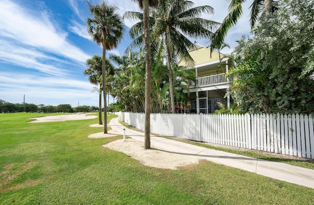 view of yard featuring a balcony