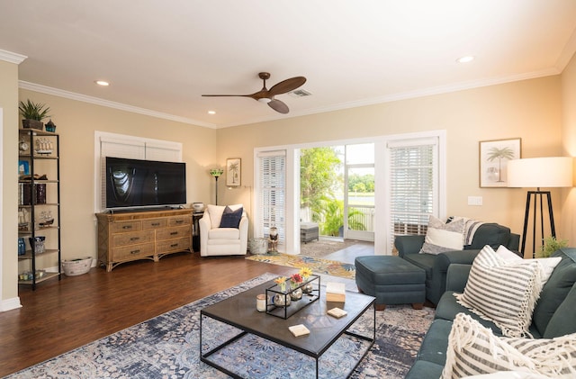 living room with ornamental molding, dark hardwood / wood-style floors, and ceiling fan