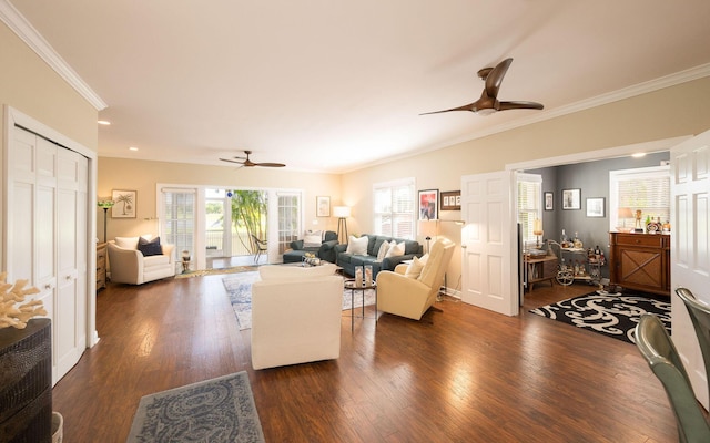 living room featuring crown molding, ceiling fan, and dark hardwood / wood-style flooring