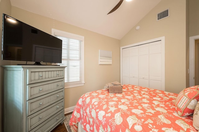 bedroom featuring vaulted ceiling, ceiling fan, and a closet