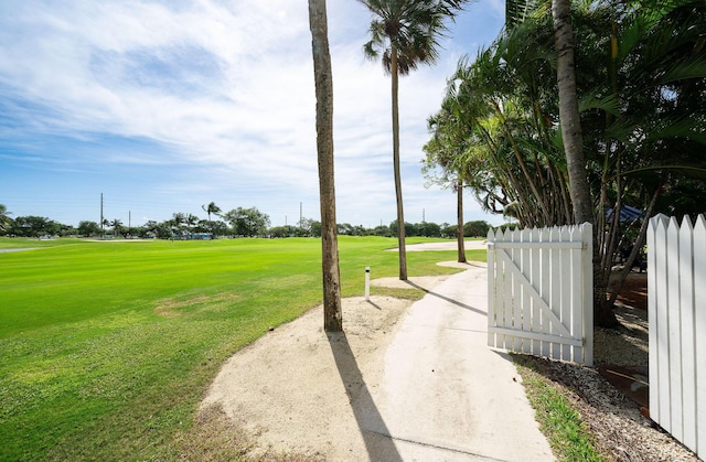 surrounding community featuring a yard