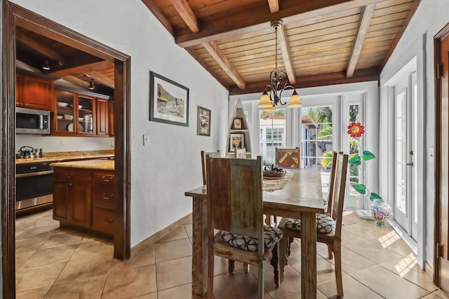 215 Whitehead St, Key West, FL 33040 - dining space with a wooden ceiling with exposed beams, a chandelier, and light tile patterned floors