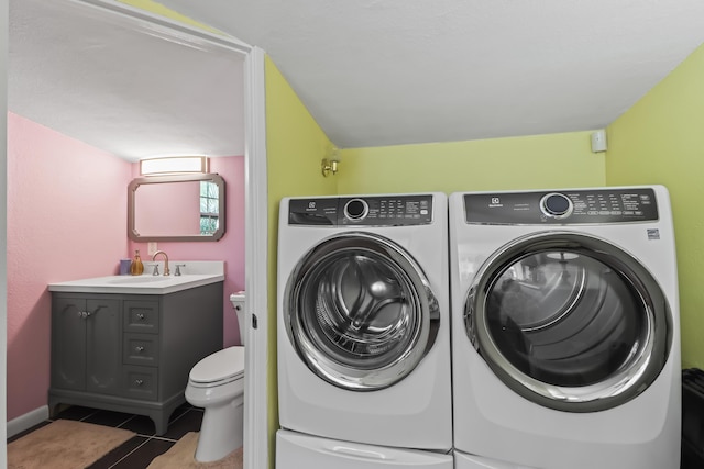 215 Whitehead St, Key West, FL 33040 - laundry room featuring separate washer and dryer and tile patterned floors
