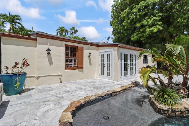 215 Whitehead St, Key West, FL 33040 - rear view of property with french doors, a patio, and stucco siding